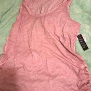 A sleeveless lace up tank mauve